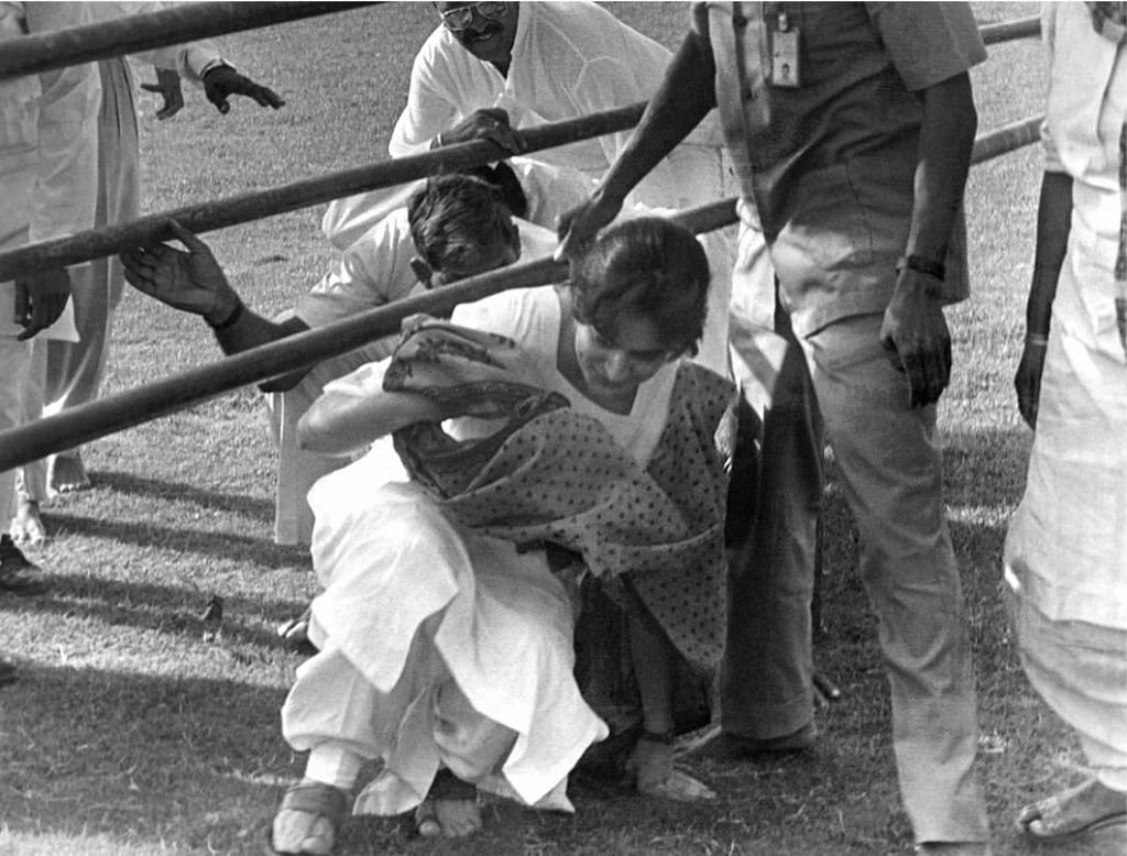  Maneka Gandhi walks out of Teen Murti House holding son Varun's hand.