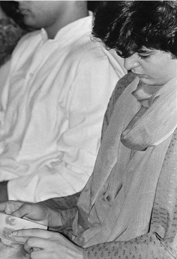  Priyanka Gandhi gazes at Rajiv Gandhi's photograph on a book cover. It was at an event on the former PM’s first death anniversary.