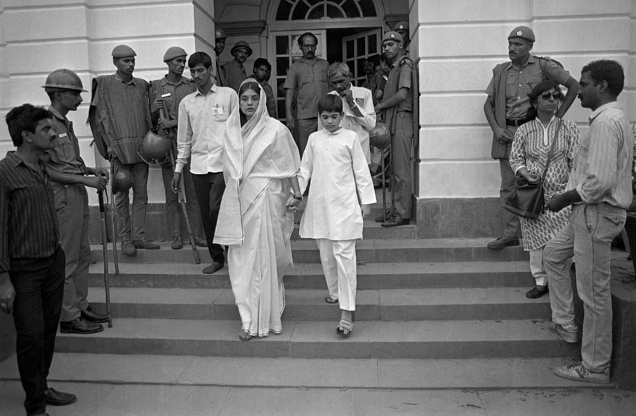 Maneka Gandhi walks out of Teen Murti House holding son Varun's hand.