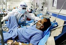 A medic treats a patient at a Covid-19 ward of Era's Lucknow Medical College and Hospital in Lucknow on 7 May 2021 | ANI