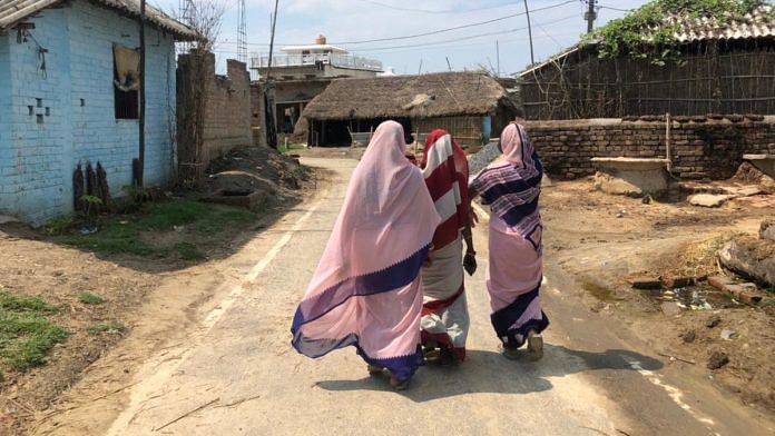 ASHA workers conduct door-to-door rounds in Jiroga village to convince residents to attend the Covid testing camp | Jyoti Yadav | ThePrint