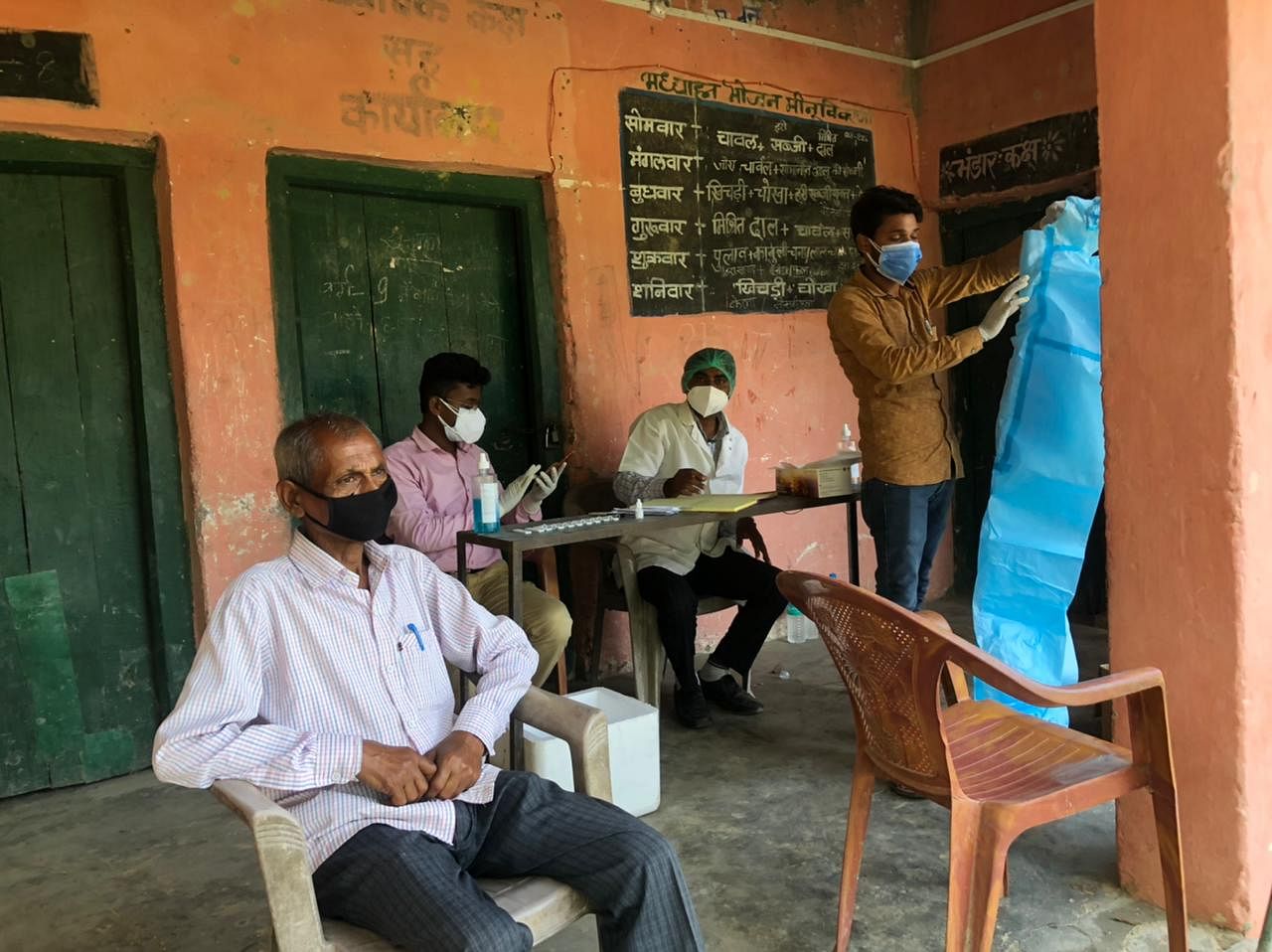 The doctor and two lab technicians get ready to start testing villagers | Jyoti Yadav | ThePrint
