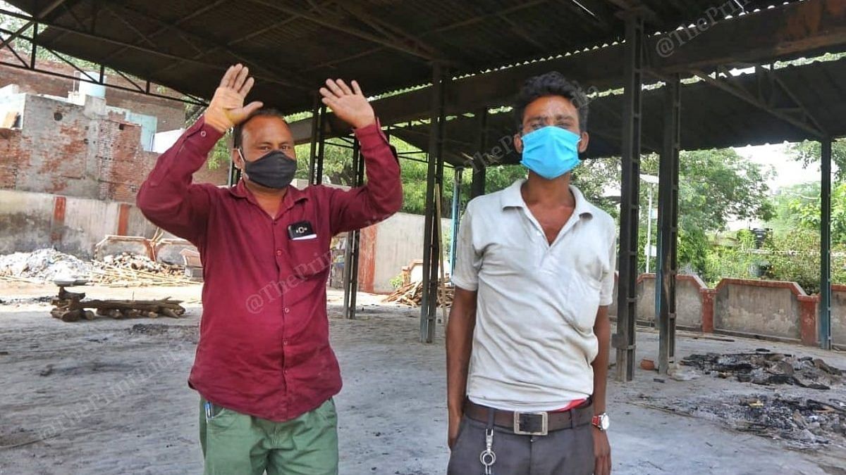 42-year-old Avdesh Kumar (left) and 24-year Devendra Kumar at the Muktidham crematorium in Aligarh | Photo: Praveen Jain/ThePrint