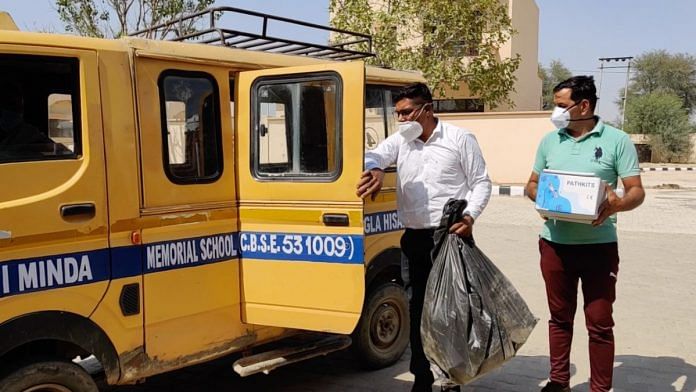 Two health workers who travel with the mobile testing van return after a day's work | Reeti Agarwal | ThePrint