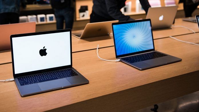 Apple Inc. MacBook Pro laptop computers sit on display at the company's Williamsburg store in the Brooklyn borough of New York | Bloomberg