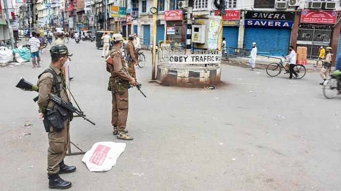 Security personnel patrol the Fancy Bazaar area to enforce shutdown after Assam State Disaster Management issued new SOPs in the wake of Covid pandemic in Guwahati, on 5 May | PTI