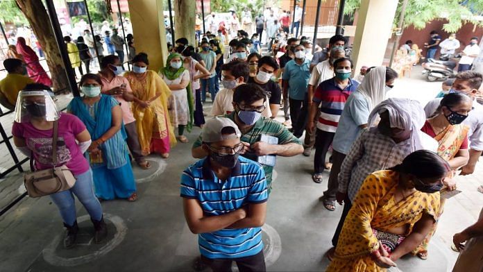 Beneficiaries wait for queues to receive Covid vaccine doses at Tej Bahadur Sapru Hospital in Prayagraj, UP, on 17 May 2021 | PTI
