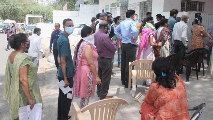People at a vaccination centre violate Covid-19 norms despite a spike in cases across the country in Faridabad, on 3 May 2021 | PTI