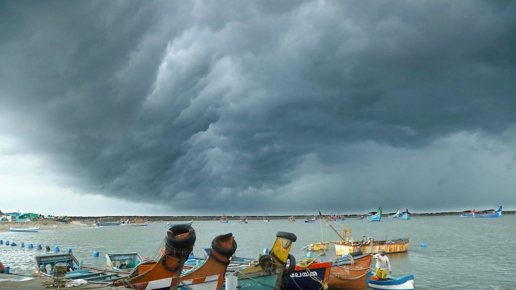 Clouds gather ahead of the landfall of Cyclone Tauktae at Vellayil Harbor in Kozhikode