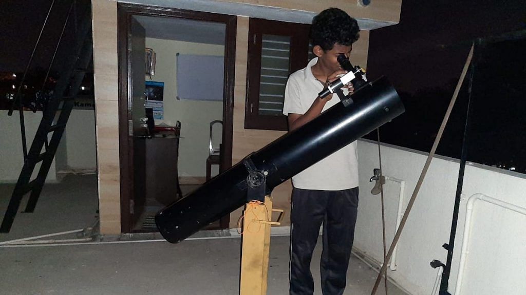 Himanshu, a young member of ABAA, looks through his telescope | Picture credit: Manasvi CM
