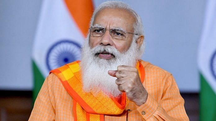 PM Narendra Modi interacting with the doctors and officials of Varanasi through video conferencing in New Delhi, on 21 May 2021 | PTI