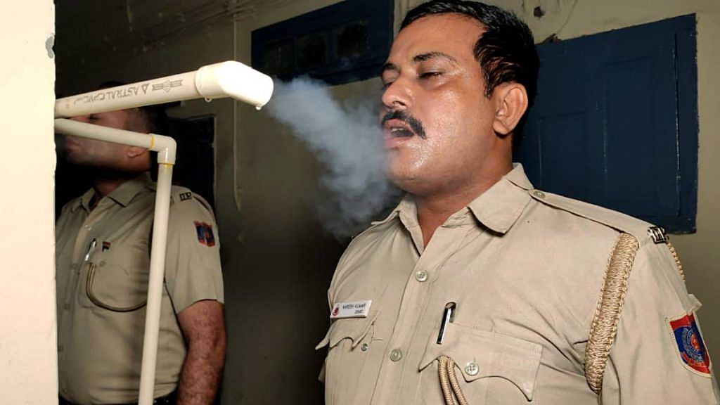 Police officers at a station in Delhi inhale steam | Representational image | ANI