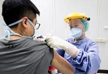 A nurse administers the AstraZeneca vaccine at Chang Gung Memorial Hospital in Taipei