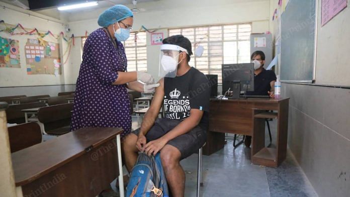 A person being vaccinated at the Jangpura Co-ed Secondary School, Delhi , which has been made into a vaccination centre | Manisha Mondal | The Print