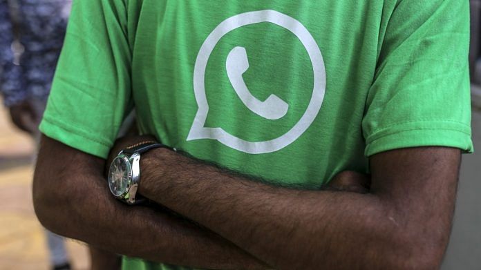 Facebook Inc. WhatsApp logo is displayed on a green t-shirt during a roadshow in Pune | Bloomberg