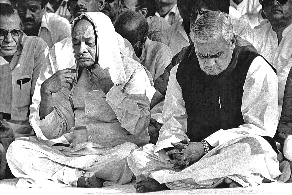 Prime Minister Narasimha Rao is unconcerned that he looks slightly odd with a gamcha covering his head to protect him from the sunlight with Atal Bihari Vajpai at samadhi | Photo: Praveen Jain