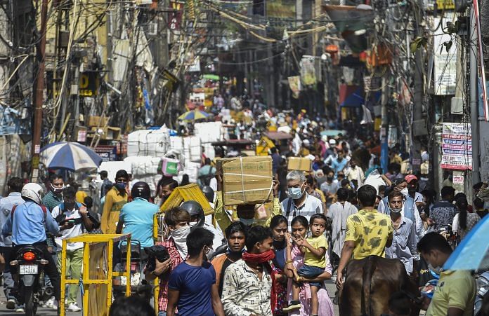 Markets reopen in Delhi Crowd at Sadar Bazar market after authorities eased Covid-induced restrictions in New Delhi, 14 June 2021 | PTI