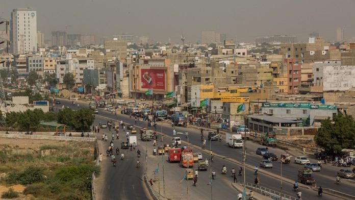 Vehicles travel along a road in the Clifton area of Karachi, Pakistan (Representational image) | Photographer: Asim Hafeez/Bloomberg