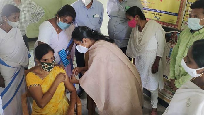 A woman gets her Covid vaccine shot at a vaccination centre in Narpala village in Ananthapur district of Andhra Pradesh on 20 June 2021 | Photo: Twitter/@ArogyaAndhra