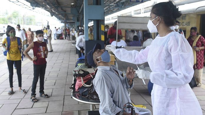 Representative Image | A BMC health worker collects swab sample of a passenger for Covid testing, at Dadar railway station in Mumbai on 22 June | PTI