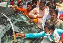 BJP workers show a sword on a damaged vehicle after clash with farmers protesting at Ghazipur border in New Delhi on 30 June 2021 |Photo: PTI
