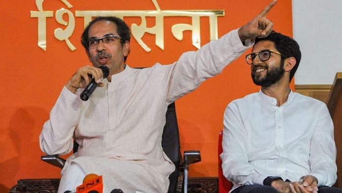 File photo of Shiv Sena chief Uddhav Thackeray (left) with Yuva Sena chief Aaditya Thackeray (right) | PTI