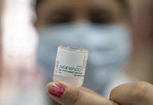 A health worker prepares a dose of the Bharat Biotech Covaxin vaccine at a Covid-19 vaccination center in New Delhi | Photographer: Sumit Dayal | Bloomberg