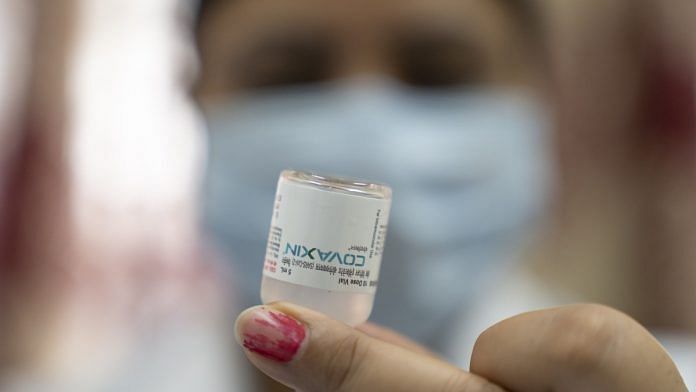 A health worker prepares a dose of the Bharat Biotech Covaxin vaccine at a Covid-19 vaccination center in New Delhi | Photographer: Sumit Dayal | Bloomberg