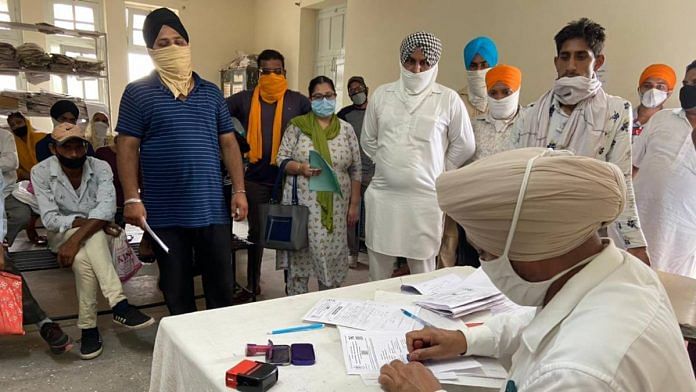 Family members of the deceased wait for death certificates inside the department issuing the documents at Rajindra Hospital, Patiala | Ananya Bhardwaj | ThePrint