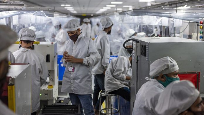 Workers manufacture phones on an assembly line at the Lava International Ltd. factory in Noida, Uttar Pradesh | Photographer: Prashanth Vishwanathan | Bloomberg