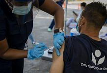 A healthcare worker administers a dose of Johnson & Johnson Covid-19 vaccine in Miami, Florida | Photographer: Eva Marie Uzctegui/Bloomberg