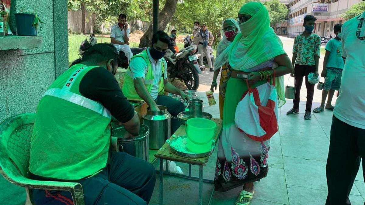 Sundar Nagri residents queueing up for food being distributed by the Delhi govt | Aneesha Bedi | ThePrint