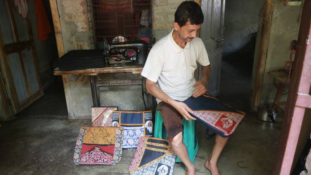 Jyotirmoy Chakraborty, who runs a Batik print unit, shows the latest dispatch of file covers with his work on it, that have not been sold yet | Manisha Mondal | ThePrint
