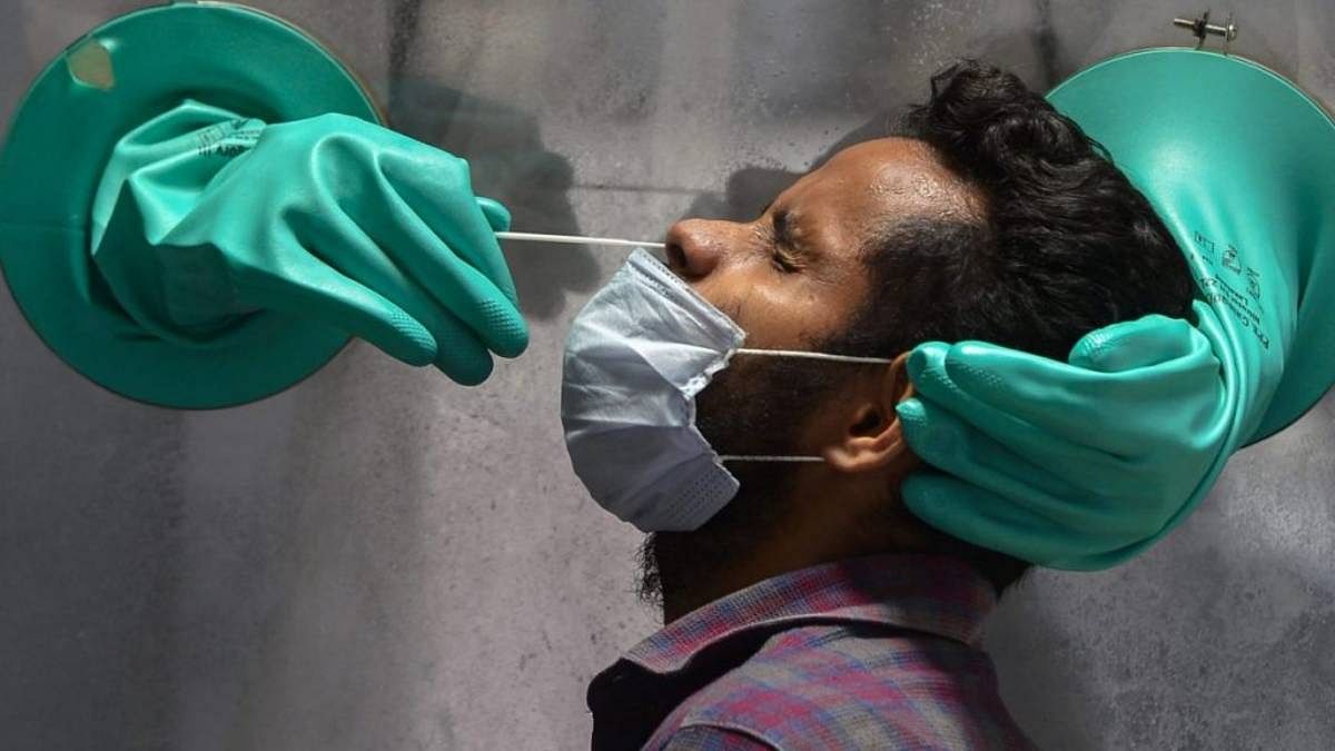 Representative Image | File photo of a swab sample being collected for Covid test | PTI