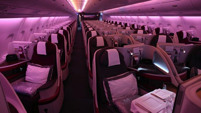 Passenger seating sits in the business class cabin of an Airbus A380-800 aircraft, operated by Qatar Airways | Photographer: Jasper Juinen | Bloomberg