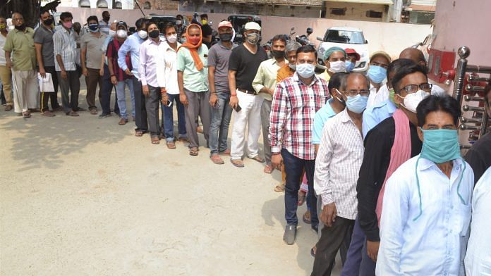 People waiting to receive Covid vaccine at a vaccination center in Varanasi, on 8 June 2021 | PTI Photo