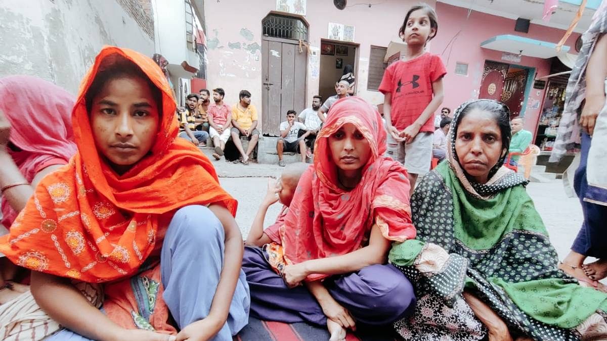 (From left) Poonam, Seema and Lata, who lost their husbands to alcohol poisoning | Shubhangi Misra | ThePrint
