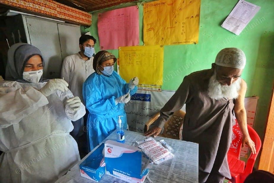 Health worker during vaccination campaign at the sub center Sonerwani village in Bandipora district in Kashmir | Photo: Praveen Jain | ThePrint