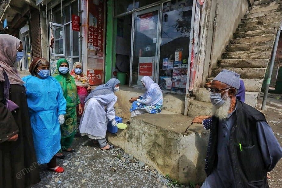 Health worker door to door vaccinating on the road during campaign at the Sonerwani village in Bandipora District in Kashmir | Photo: Praveen Jain | ThePrint