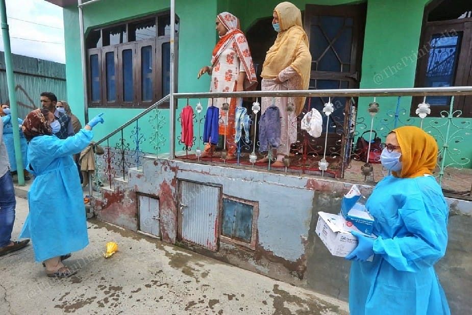 Health worker going door to door for vaccination at the Mantrigam village in Bandipora Distt in Kashmir | Photo: Praveen Jain | ThePrint