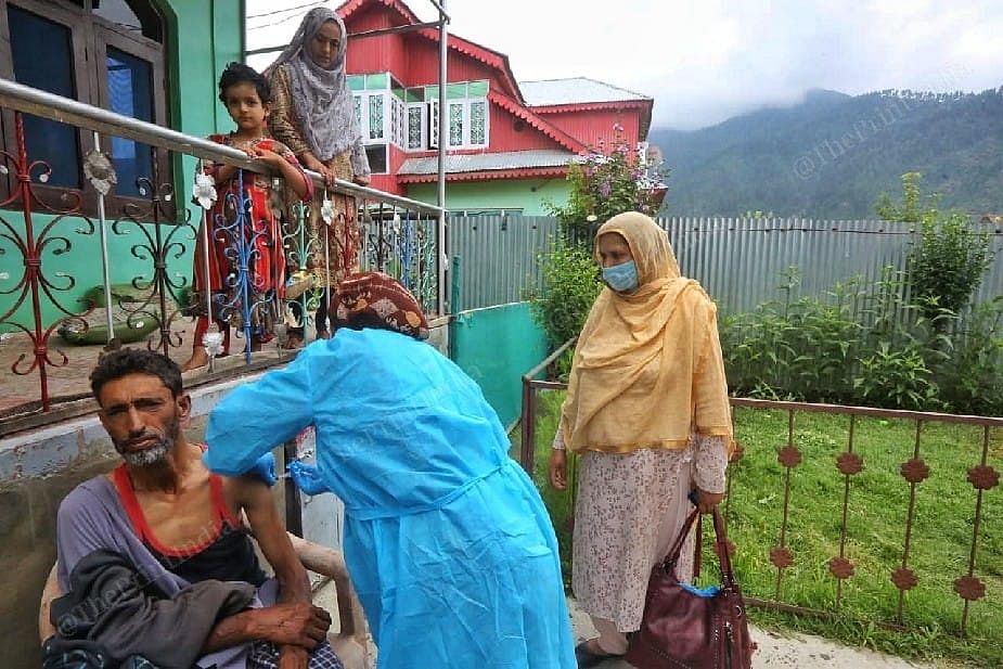Health worker vaccinating at the Mantrigam village in Bandipora Distt in Kashmir They are going door to door | Photo: Praveen Jain | ThePrint