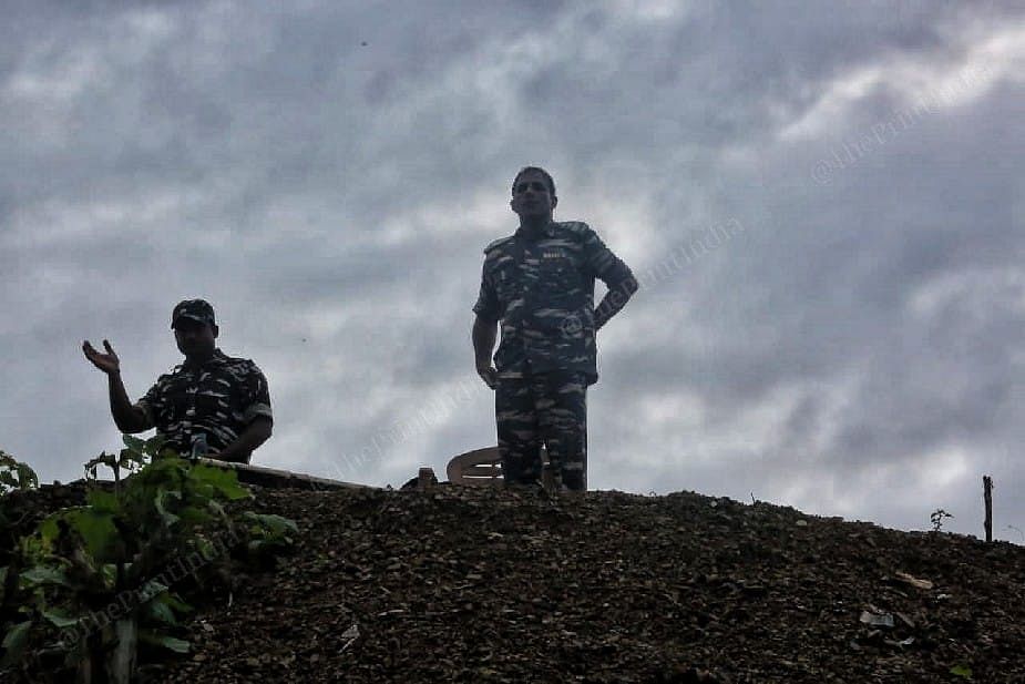 Assam police watching on the top of the highway at their camp at Lailapur post