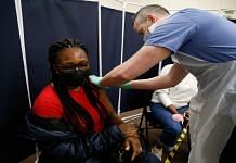 Representational image | A person receives a dose of the AstraZeneca Covid-19 vaccine in Stratford, London | Bloomberg