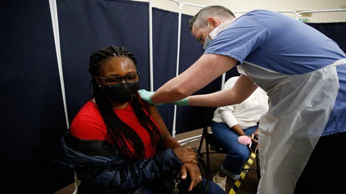 Representational image | A person receives a dose of the AstraZeneca Covid-19 vaccine in Stratford, London | Bloomberg