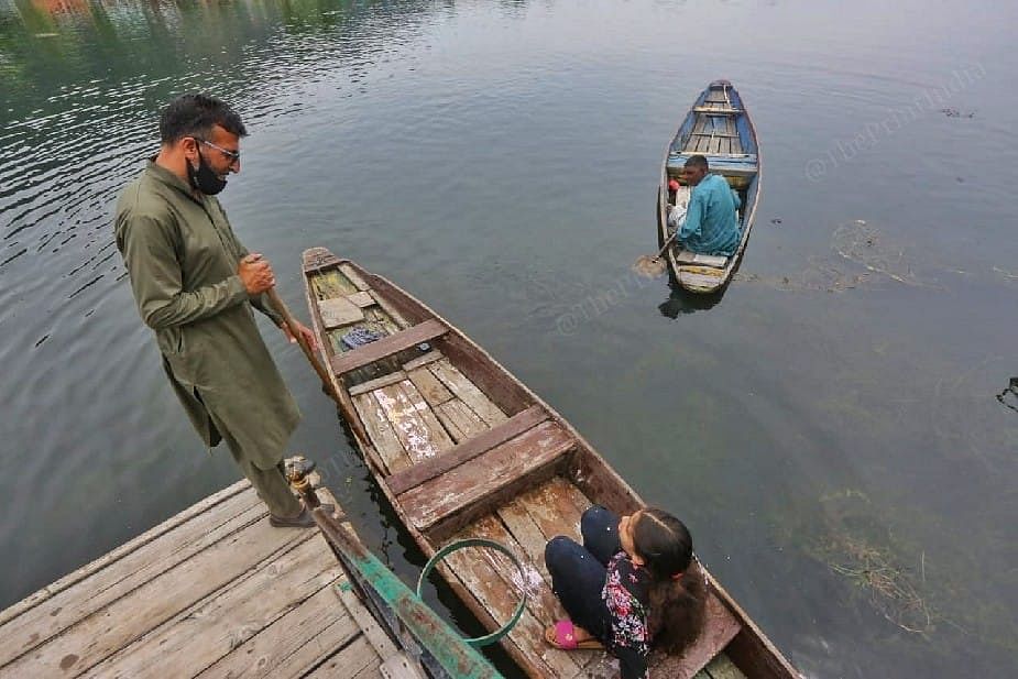 As Jannat leaves for a boat ride, father Ahmad gives her instructions | Photo: Praveen Jain | ThePrint