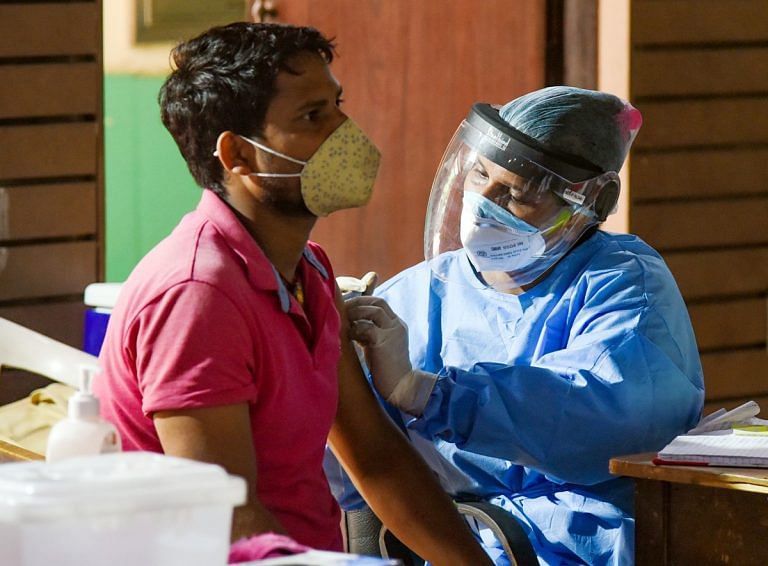 Double vaccination halves risk of developing long-lasting Covid symptoms
