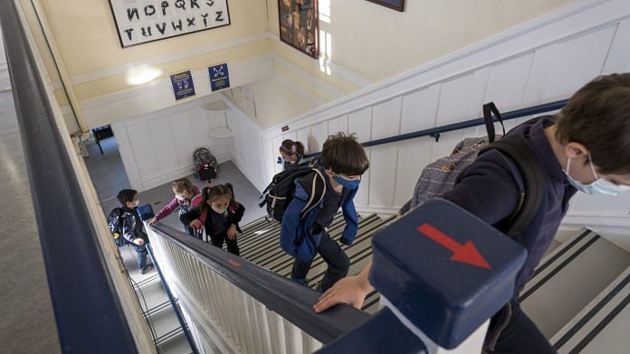 Elementary Students Attend Class For In-Person Learning Students wearing protective masks at an elementary school in San Francisco | David Paul Morris | Bloomberg