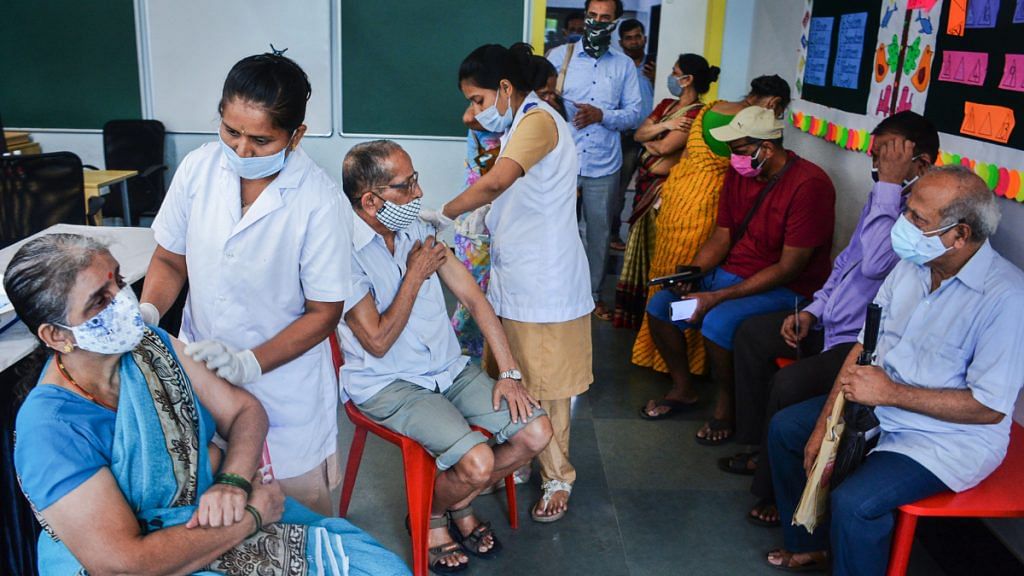 Health workers administer Covid-19 vaccine dose to senior citizens, at Thane on 7 July 2021| Photo: PTI