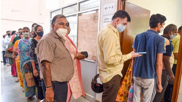 Beneficiaries wait to receive Covid-19 vaccine dose, at a government hospital in Bikaner on 8 July 2021| Photo: PTI