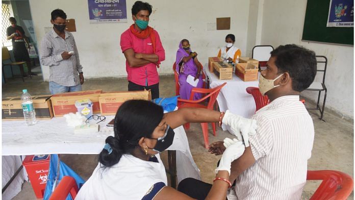 A medic receives a dose of Covid-19 vaccine at a central school, in Patna on 19 July 2021| PTI